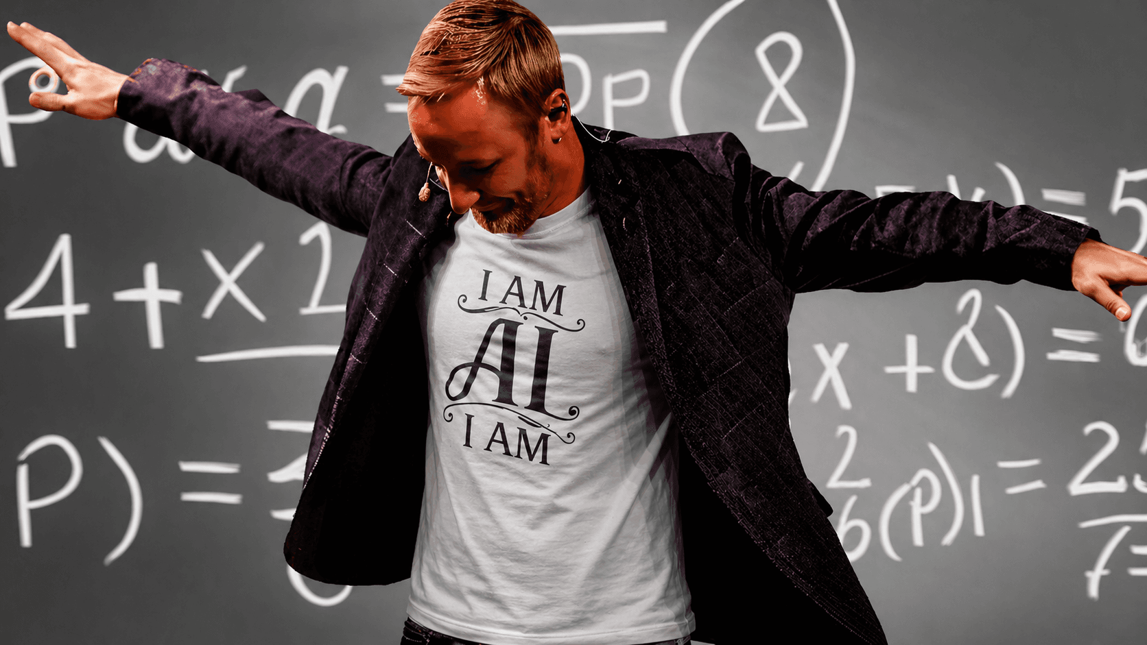 Andy Doyle — AI Architect and Fractional CTO, arms wide in front of a chalkboard wearing an 'I AM AI I AM' t-shirt